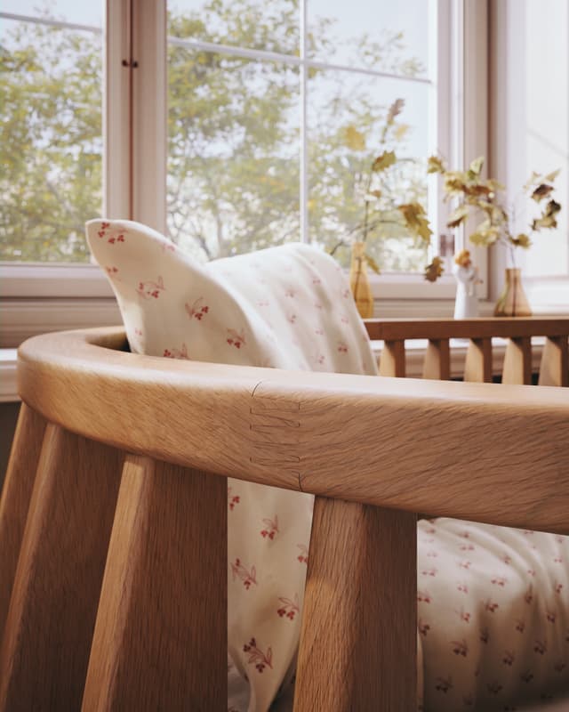 Sol Baby wooden crib close-up in a cozy nursery